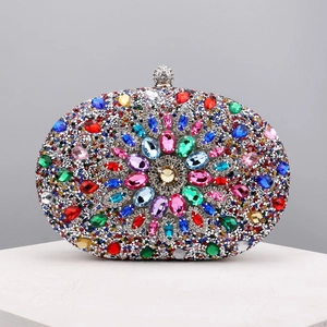 Macro detail of multicolored rhinestones and crystals on silver evening clutch bag