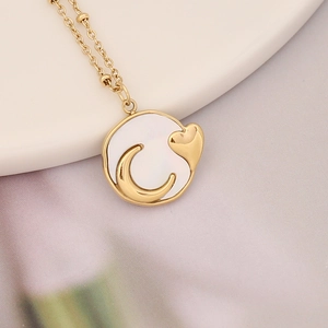 Golden stainless steel necklace with shell pendant featuring crescent moon and heart motif