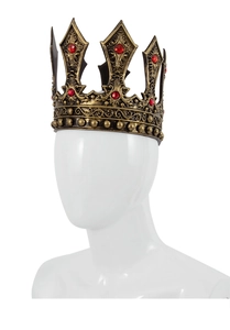 Macro view of vintage gold crown featuring intricate filigree and red rhinestone details