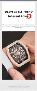 Close-up of luxury tonneau-shaped watch with rose gold diamond bezel on male wrist