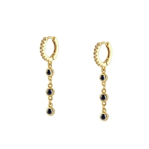 Close-up of gold chain earrings with micro-set zircons and three black gemstones
