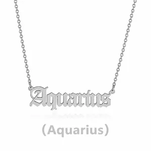 Macro view of silver stainless steel Aquarius zodiac pendant with gothic lettering