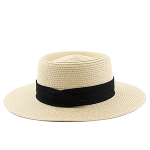 Classic beige straw boater hat with a wide black ribbon for summer sun protection