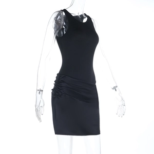 Side view of black sleeveless mini dress featuring ruched details and satin finish