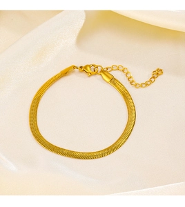 Detail of gold-plated stainless steel snake chain bracelet with lobster clasp and extender