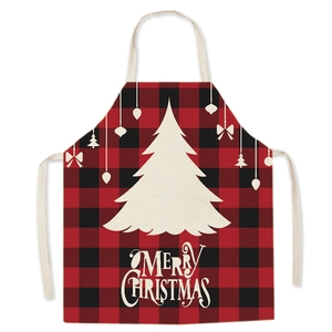 Detail of red and black buffalo plaid linen apron with white Christmas tree print