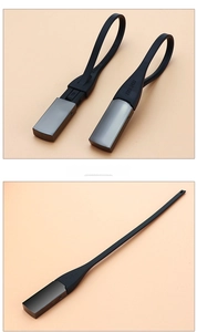 Close-up of flexible black handle and sleek metallic shoehorn with a modern minimalist design