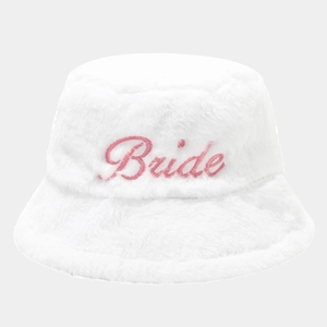 Close-up of white plush bucket hat with pink Bride embroidery for bridal parties