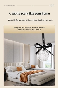Detailed view of white rose aroma stone with black ribbon in a cozy bedroom setting