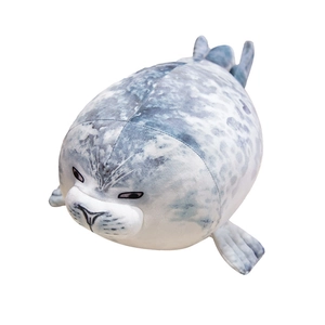 Soft spotted seal plush toy pillow with funny expression on a plain white background