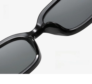 Detail of ergonomic integrated nose pads on high-gloss black sunglasses frames
