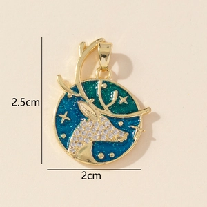 Close-up of golden reindeer pendant with crystals and blue enamel starry sky detailing