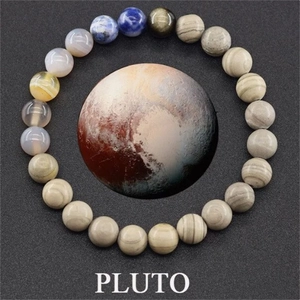 Macro shot of Pluto themed natural stone bead bracelet with gray and blue galaxy texture