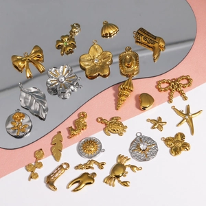 Creative collection of gold and silver DIY metal charms including bowknot and shell shapes