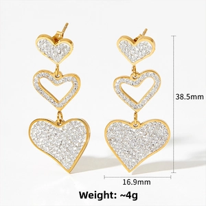 Detailed size view of gold triple heart drop earrings with sparkling rhinestones