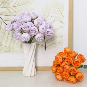 Artificial tea rose and peony flower bouquet in white vase for home decor and weddings