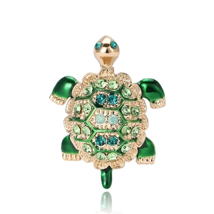 Exquisite turtle brooch with green enamel and sparkling rhinestones in gold setting
