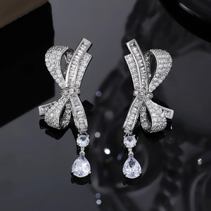 Sparkling bow water drop earrings with silver metal and full cubic zirconia stones