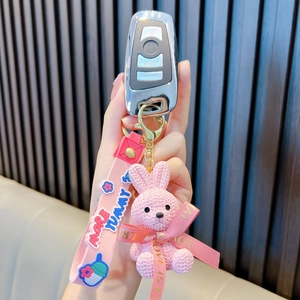 Süßer rosa gestrickter Kaninchen Schlüsselanhänger mit Schleife und Silikonriemen für Taschen