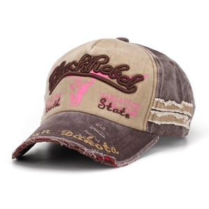 Close-up of distressed vintage baseball cap with BlackRebel embroidery and worn-out details