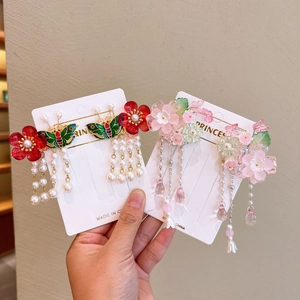 Detail of Hanfu hair clips with red flowers, green butterflies, and long pearl tassels