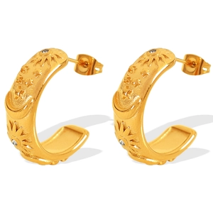 French vintage gold C-shaped earrings with sun moon and star relief and zircons