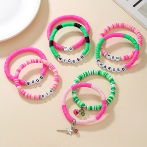 Detail of multi-layer witch theme elastic bracelets with colorful Heishi beads and charms