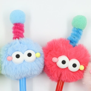 Close-up of cute furry monster pens with plush texture and colorful antenna details