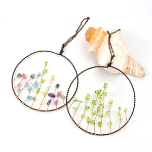 Detail of handmade Tree of Life wall hanging with colorful crystals and bronze wire