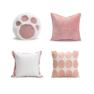 Nordic modern cat paw plush pillows and pink velvet decorative cushions set on white background