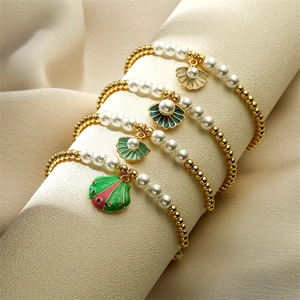 Bracciale Di Künstliche Perle Con Conchiglia In Smalto Rame Placcato Oro Stile Spiaggia Oceano Per Donne
