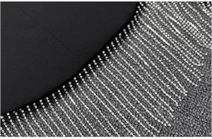 Macro shot of sparkling silver rhinestone fringe details on black long sleeve blazer jacket