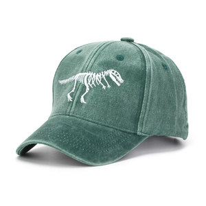 Detailed embroidery of T-Rex skeleton on washed cotton canvas baseball cap in dark green