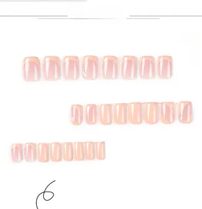 Detail of pink French gradient press-on nails with white tips and glossy finish