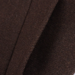 Close-up of deep brown wool fabric showing the thick texture and soft fiber details