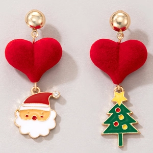Close-up of asymmetrical Christmas tree and Santa earrings with red flocked hearts