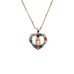 Bohemian gold heart necklace with colorful zircons and Virgin Mary relief on white background