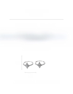 Macro detail of eight-pointed star earrings with zircon inlay and copper finish