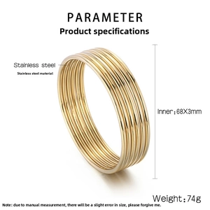 Macro view of 10 gold stainless steel bangles with 68mm diameter and 3mm thickness