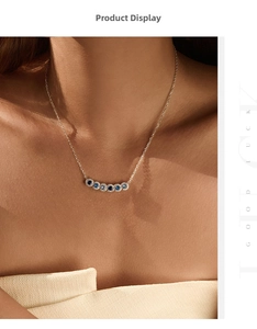 Detail of S925 silver necklace with seven gradient blue sapphire pendant stones