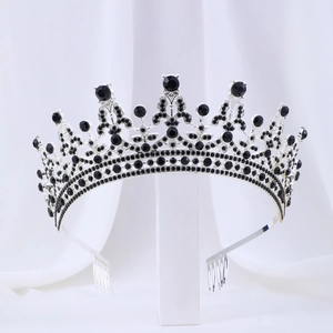 Detailed macro view of bridal silver crown with black crystals and securing hair combs