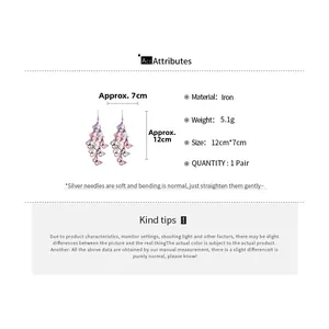 Détails des boucles d'oreilles papillon avec dimensions et spécifications du métal