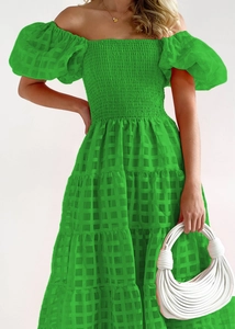 Detail of green off-shoulder puff sleeve dress with smocked bodice and plaid texture