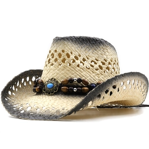 Detail of straw cowboy hat featuring blue turquoise beads and vintage metal accents