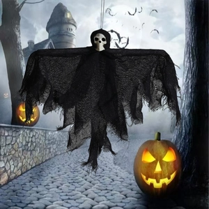 Hanging Halloween skeleton ghost with black tattered gauze against a spooky castle background