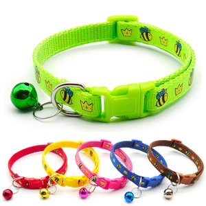 Close-up of durable nylon pet collar with festive snowflake prints and metal bell