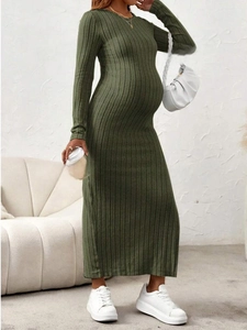Close-up of olive green ribbed knit maternity dress showing high-quality fabric texture