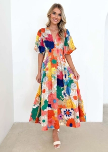 Detail of floral puff sleeve maxi dress with deep V-neck and vibrant multi-color print