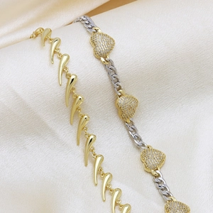 Two-tone gold and silver heart necklace with zircon pave and spiked cuban chain links