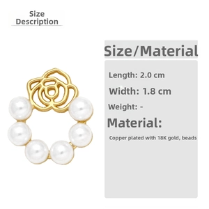 Detail of 18k gold plated flower earring with pearls measuring 2.0cm by 1.8cm